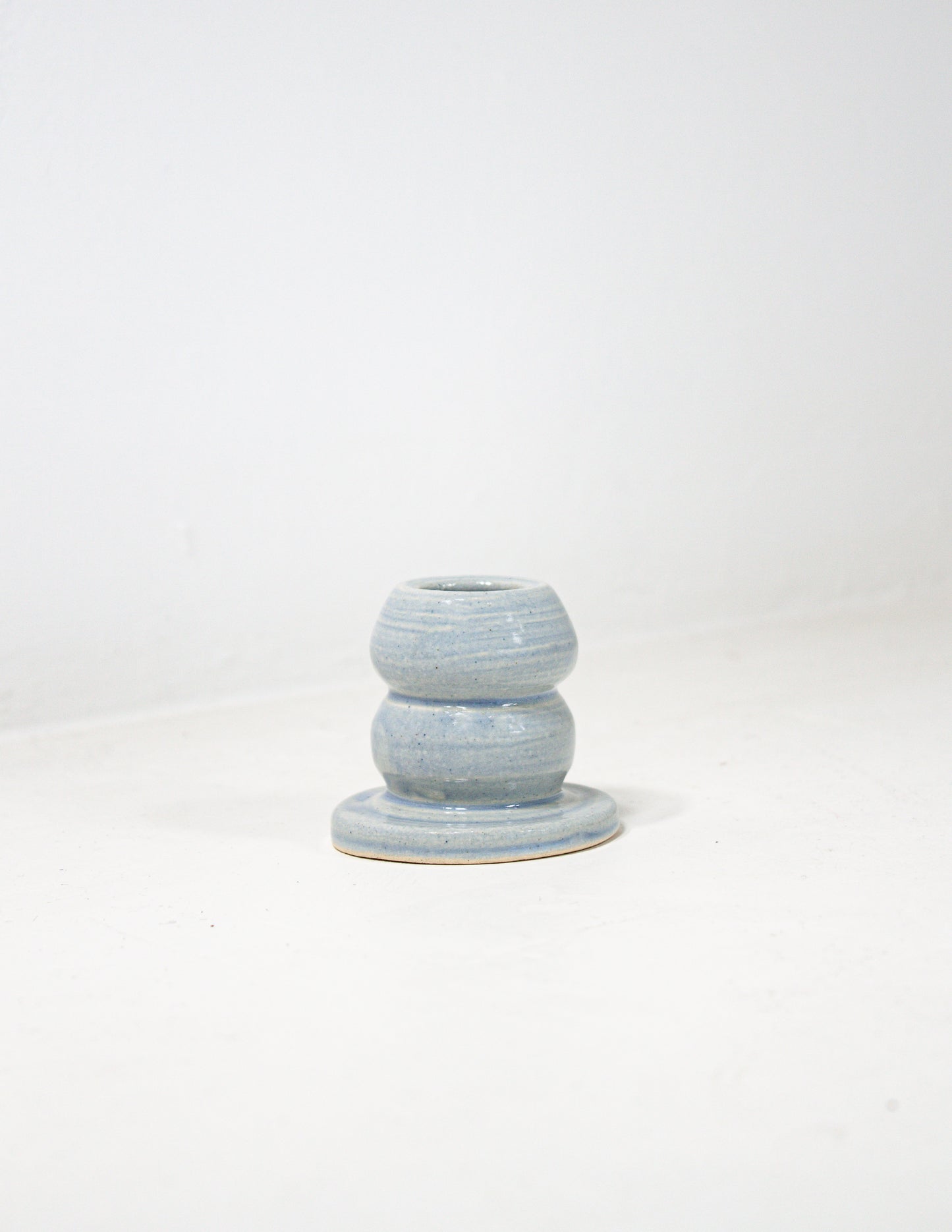 Short bubble candle stick holder in blue glaze