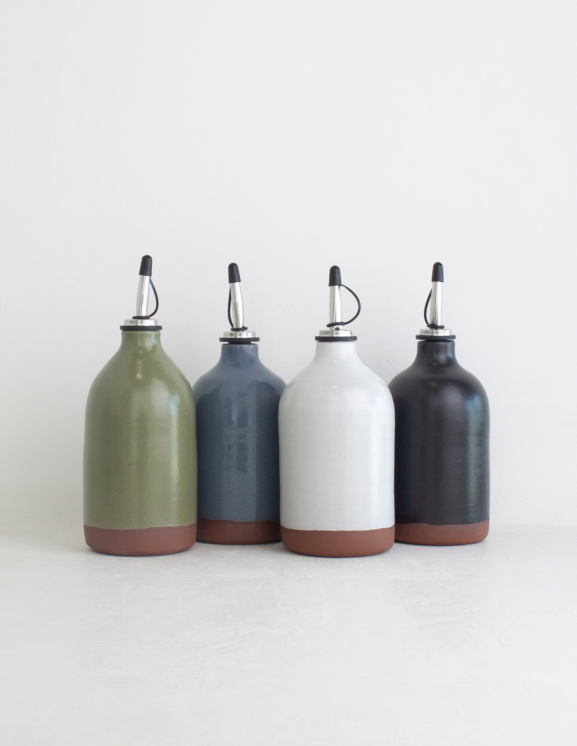 Grouping of four handmade oil cruets