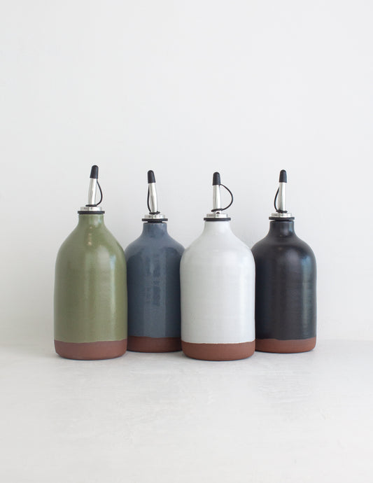 Grouping of four handmade oil cruets