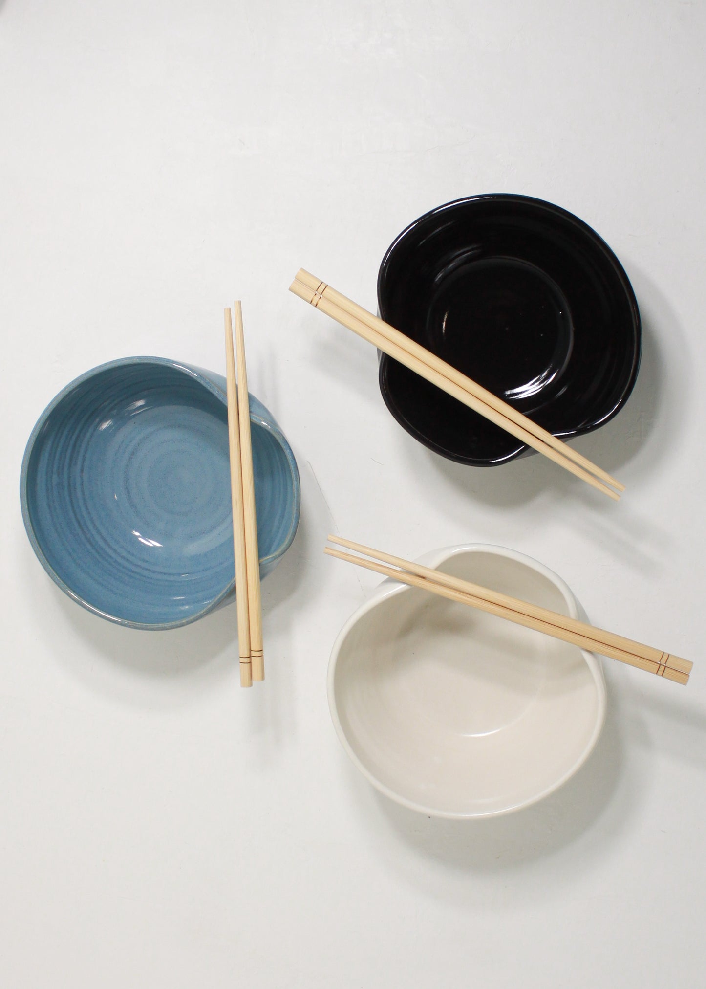 Handmade ceramic ramen bowl featuring a folded lip for a convenient utensil holder. These Handmade bowls are made by Black Oak Art in Waco, Texas.