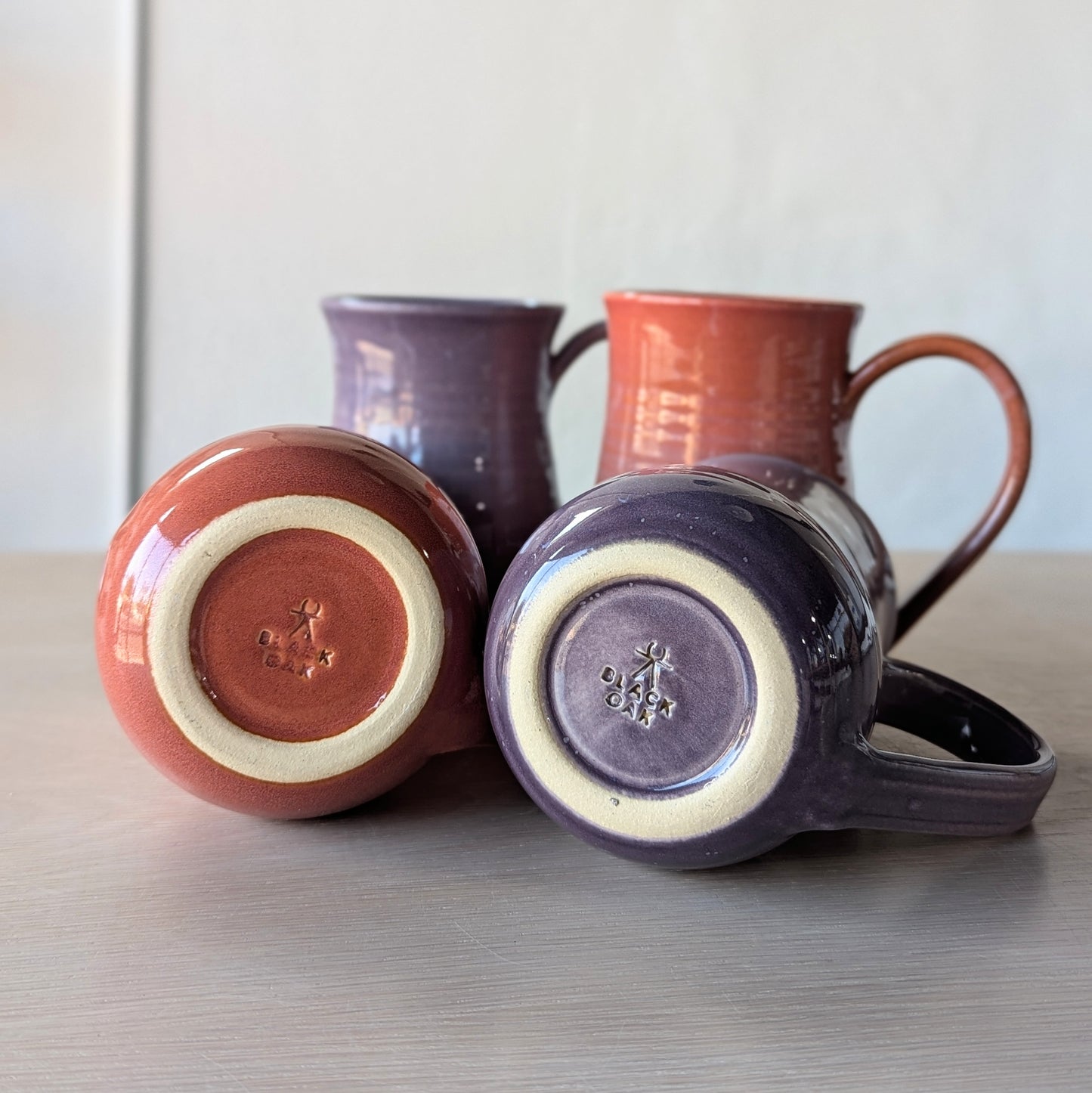 tall potbelly hand thrown handmade mugs orange and purple