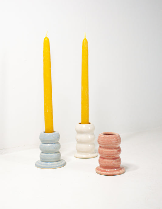 A group of handmade ceramic candle stick holders