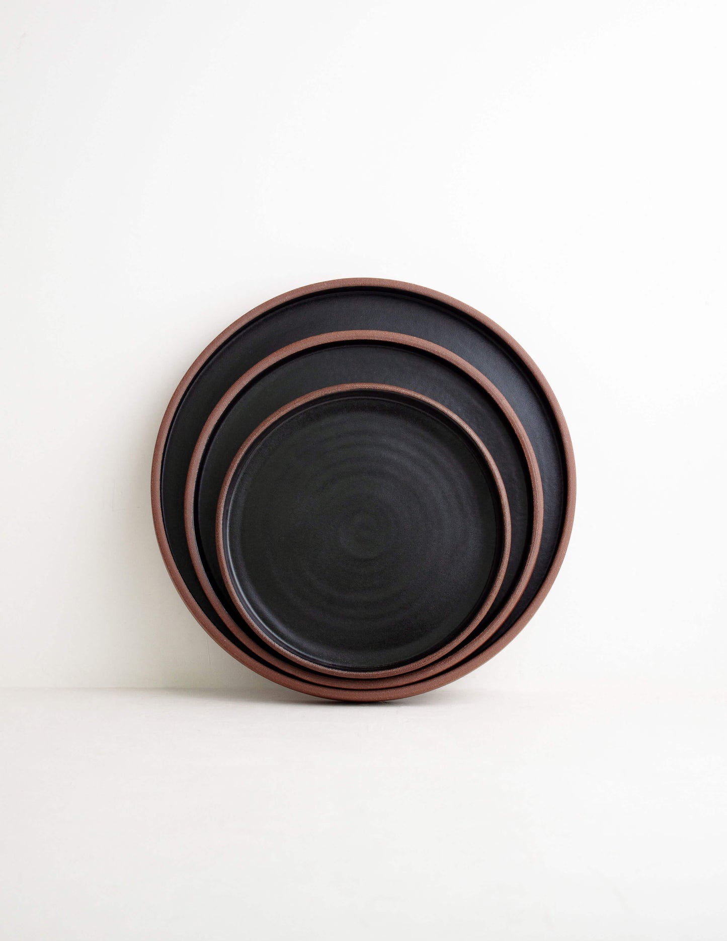 Handmade dark clay ceramic straight dinner plate near me