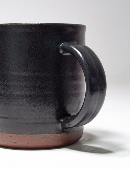 Hand thrown mug dipped in a black glaze