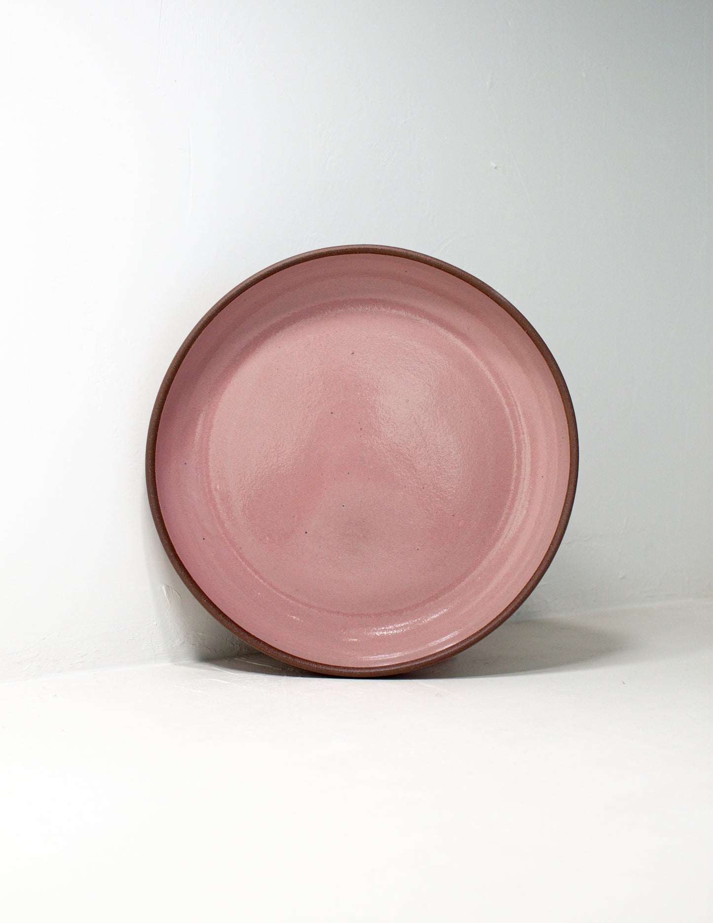 hand thrown serving bowl glazed in pink