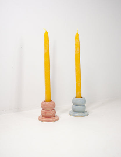 Two ceramic candle stick holders in bubble shape with pink and blue glazes