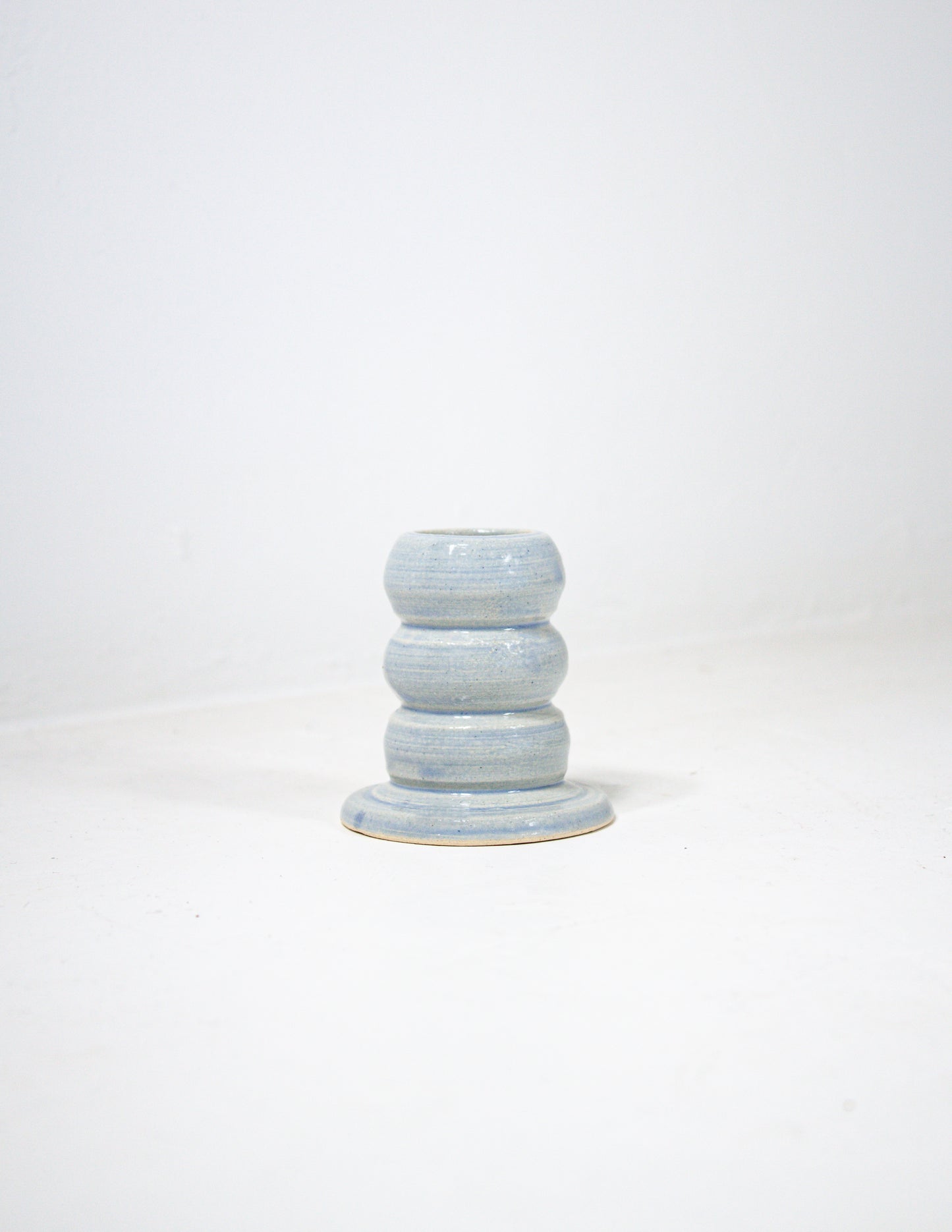 Handmade bubble candle stick holder in blue glaze