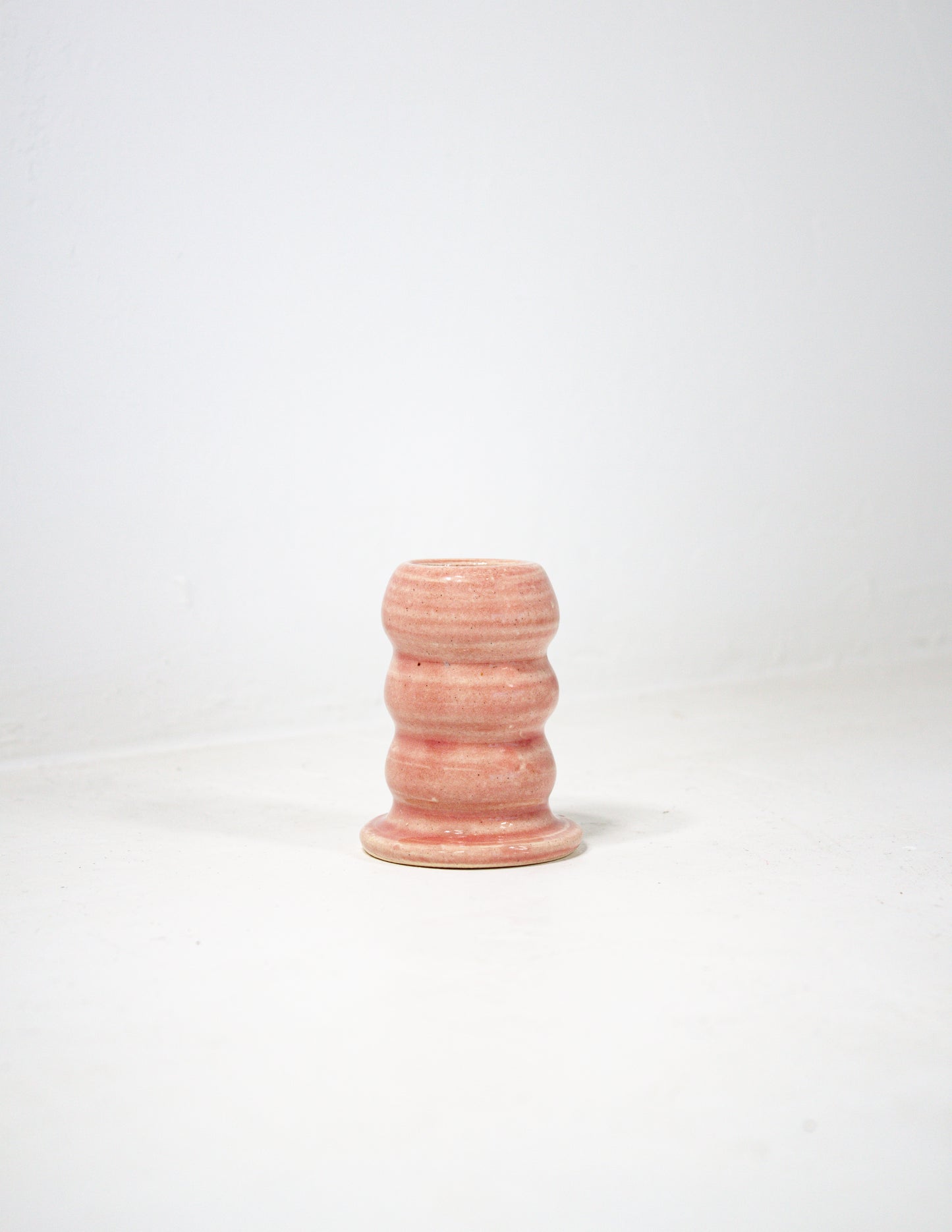 Handmade ceramic candle stick holder in pink glaze