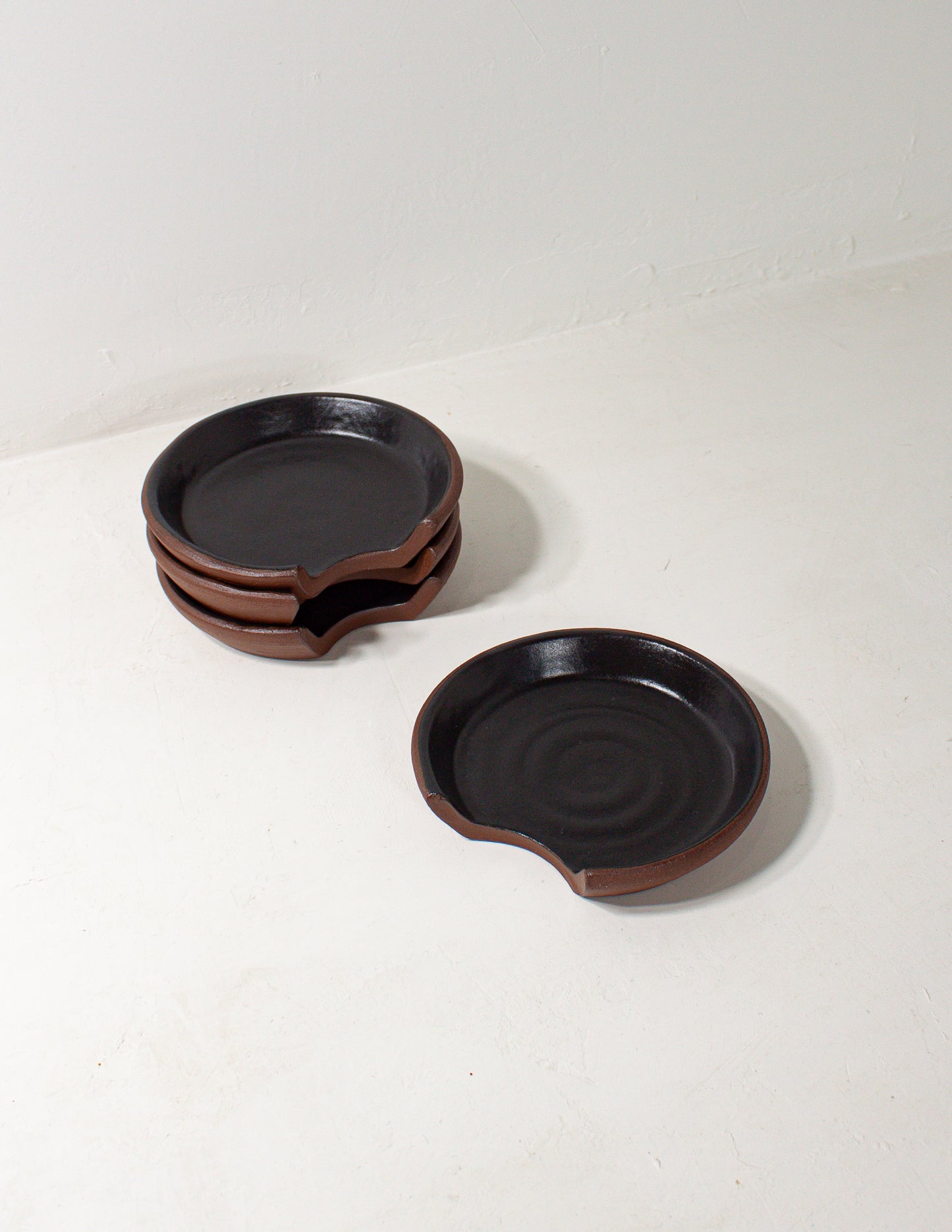 handmade ceramic spoon rest in black glaze