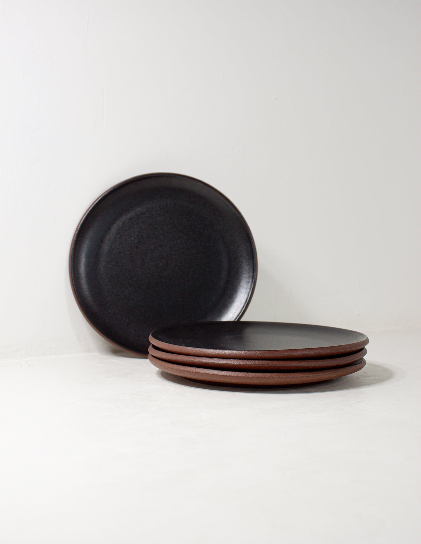 black salad plate as a part of our handmade plates set glazed in a black glaze