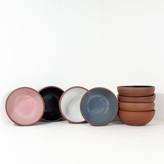a group of handmade cereal bowls