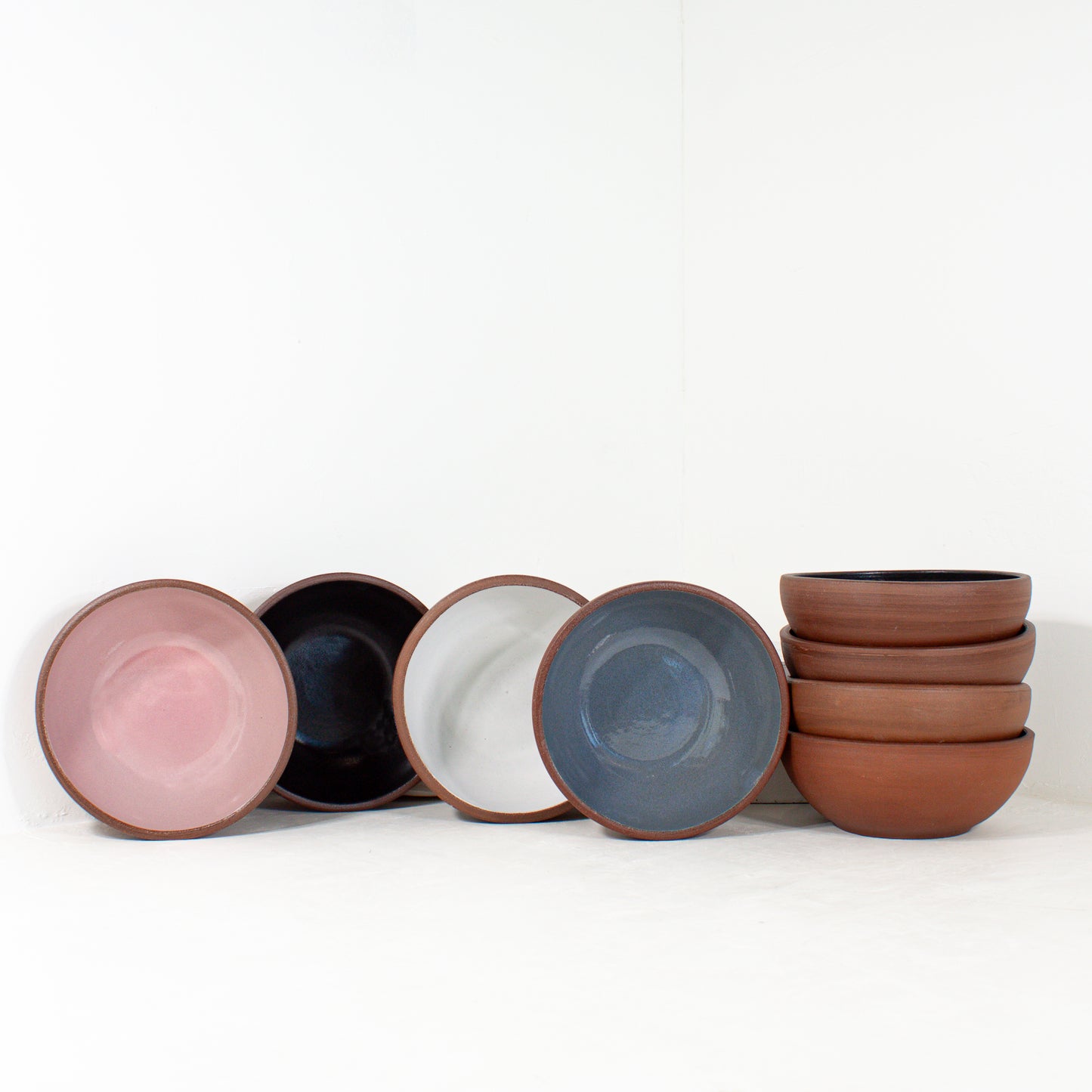 a group of handmade cereal bowls