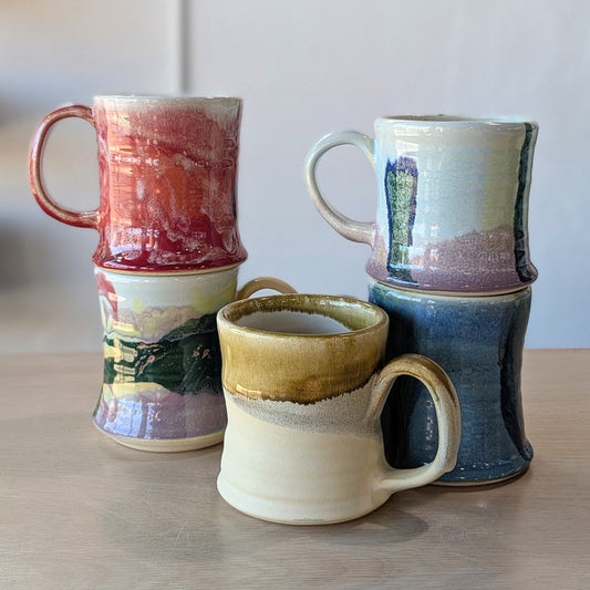five handmade hand painted ceramic mugs red rainbow gold sand blue