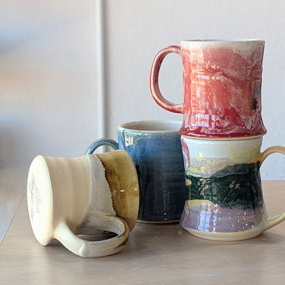 four handmade hand painted ceramic mugs red rainbow gold sand blue