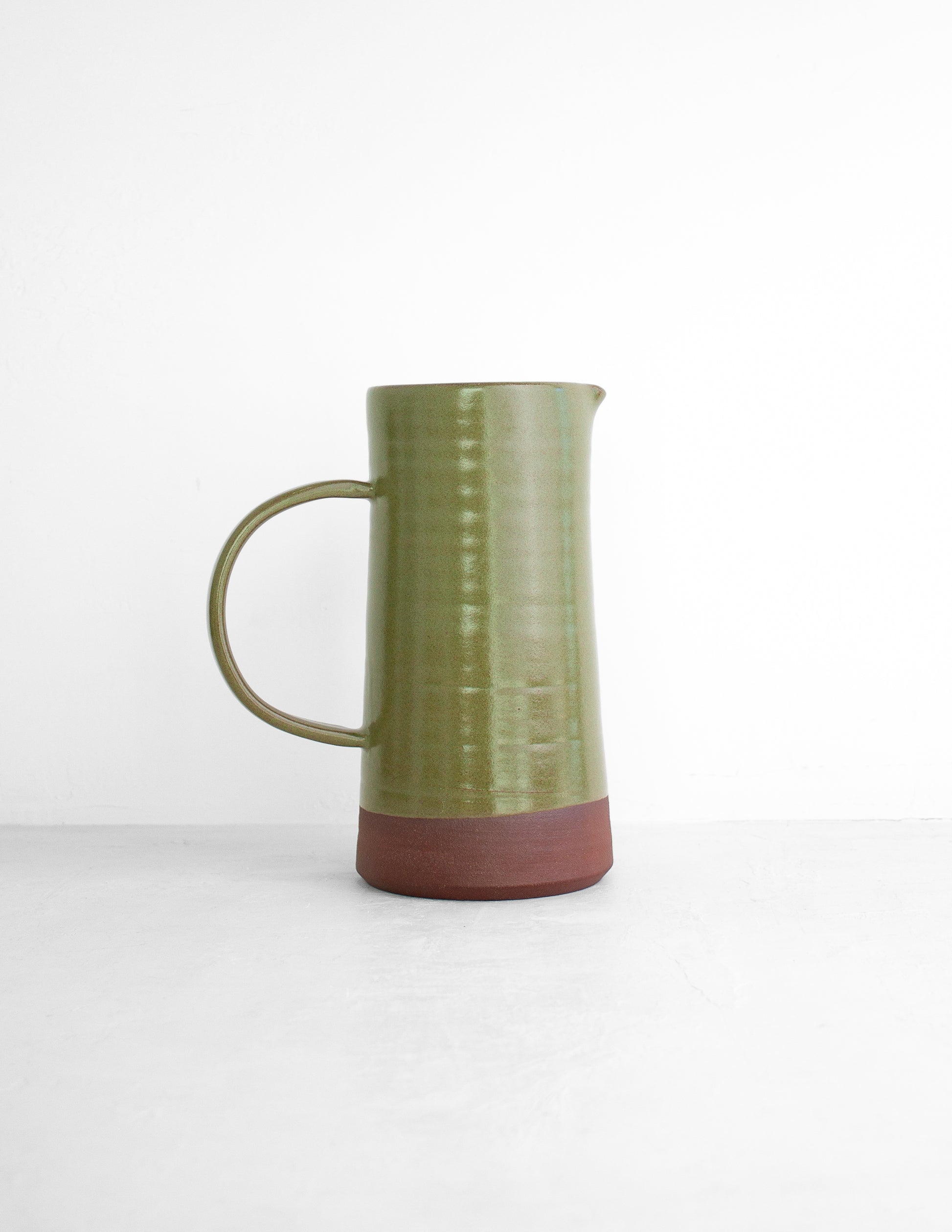 Handmade modern pitcher glazed in moss green