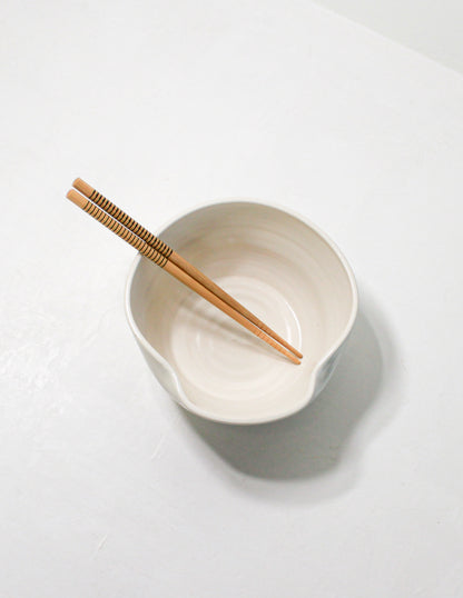 Handmade ceramic ramen bowl featuring a folded lip for a convenient utensil holder. These Handmade bowls are made by Black Oak Art in Waco, Texas.
