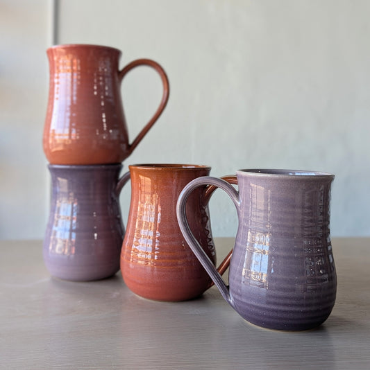tall potbelly hand thrown handmade mugs orange and purple