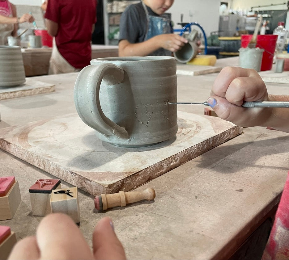 Team building pottery mug assembly class